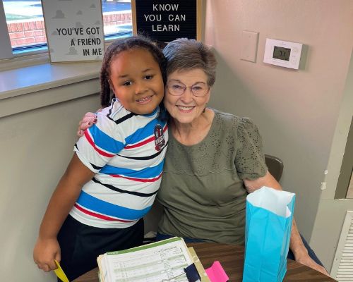  A student and a volunteer helper