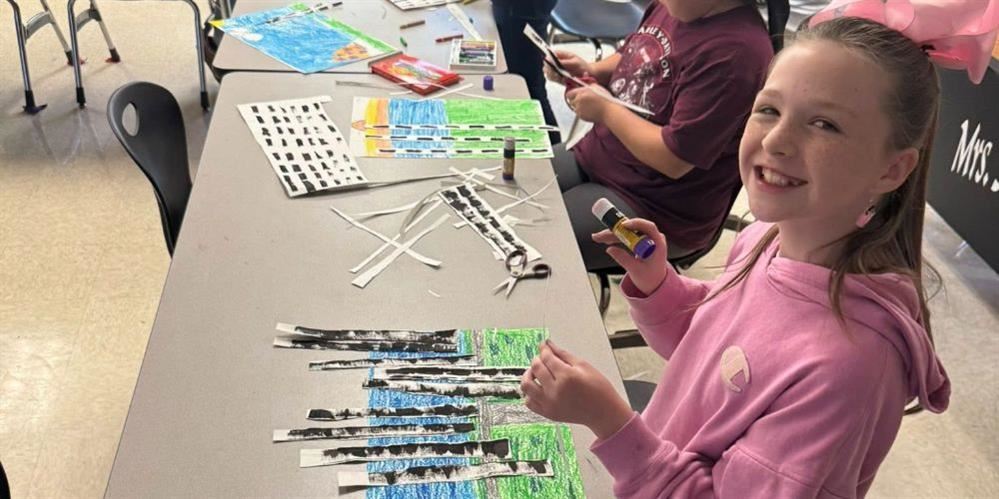  Student working on her project in art.