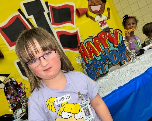 Girl at Birthday Table