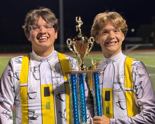  two boys hold trophy
